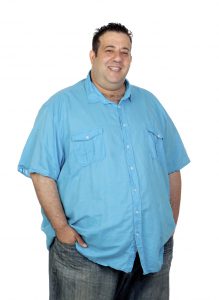 Happy fat man with blue shirt isolated on white background